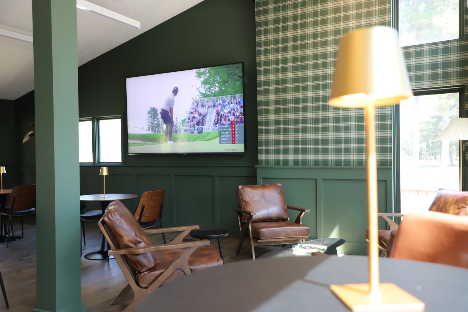 Clubhouse lounge seating with golf on television